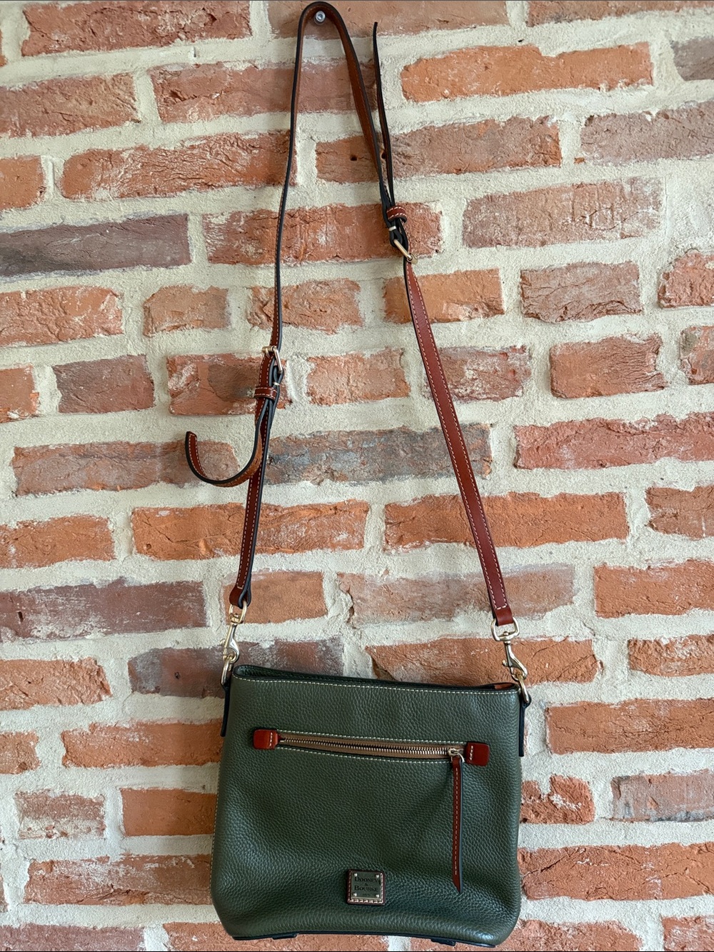 Pebbled Olive Green Dooney & Bourke Crossbody Bag with Brown Adjustable Strap